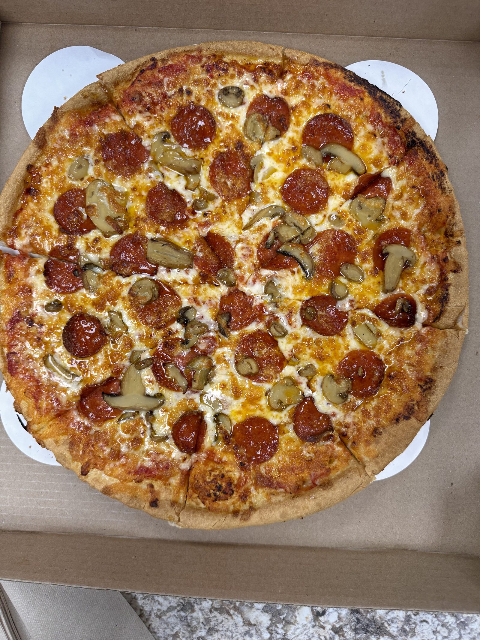 A pizza fresh out of the oven at Smithfield Pizza House